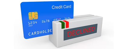 An illustration of a credit card going through a swiper that reads "DECLINED" in red letters