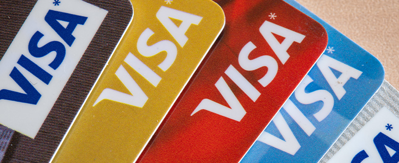 Credit card fanned out displaying the Visa logo