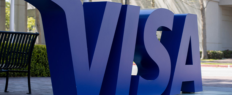 A statue of the blue Visa logo outside of Visa's Foster City, CA